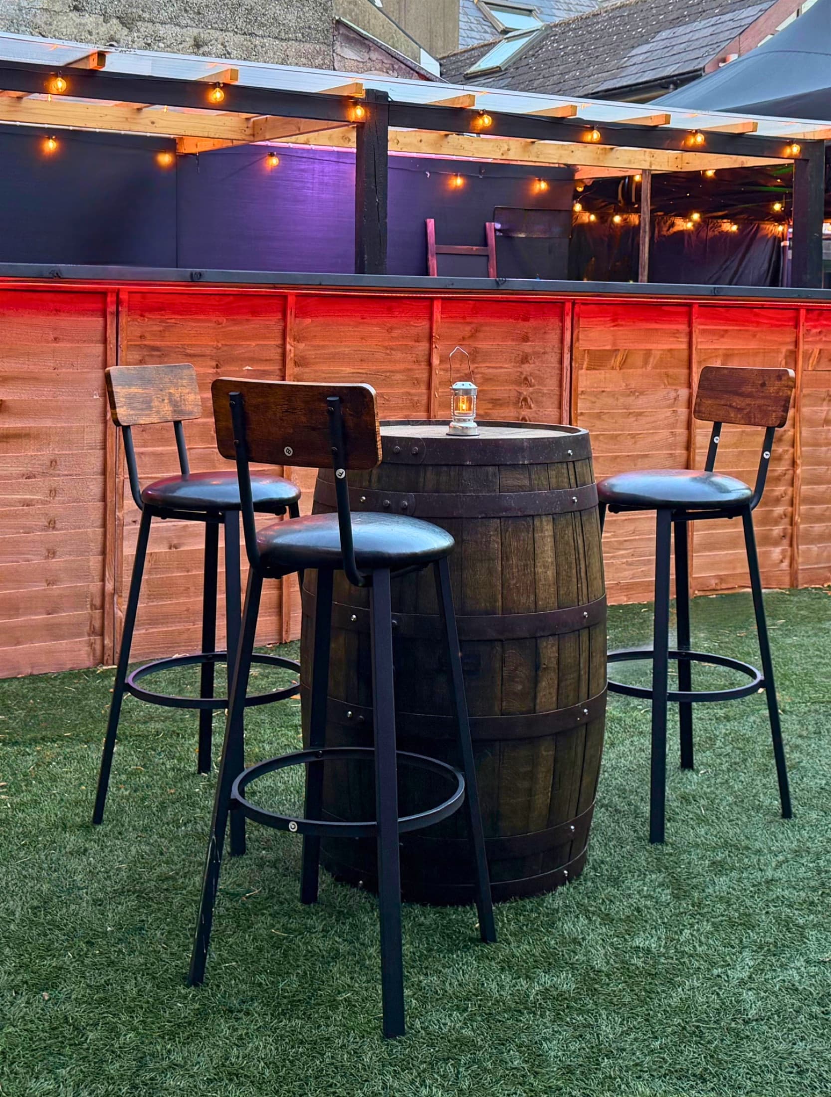 The courtyard bar lit up in the evening